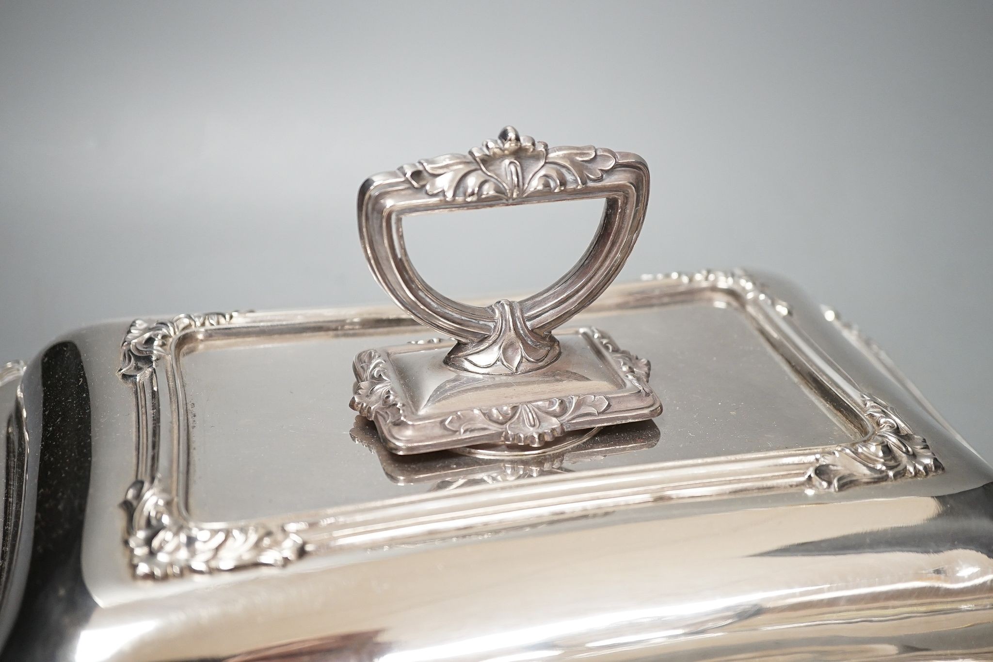 A pair of electroplate entree dishes and covers, 30cm